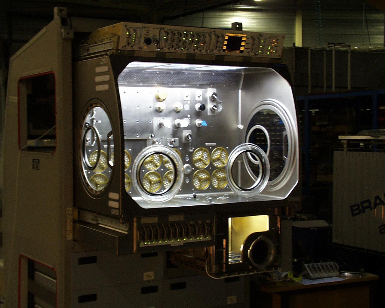 Interior lights give the Microgravity Science Glovebox (MSG) the appearance of a high-tech juke box. The European Space Agency (ESA) and NASA are developing the MSG for use aboard the International Space Station (ISS). Scientists will use the MSG to carry out multidisciplinary studies in combustion science, fluid physics and materials science. The MSG is managed by NASA's Marshall Space Flight Center (MSFC). Photo Credit: NASA/MSFC