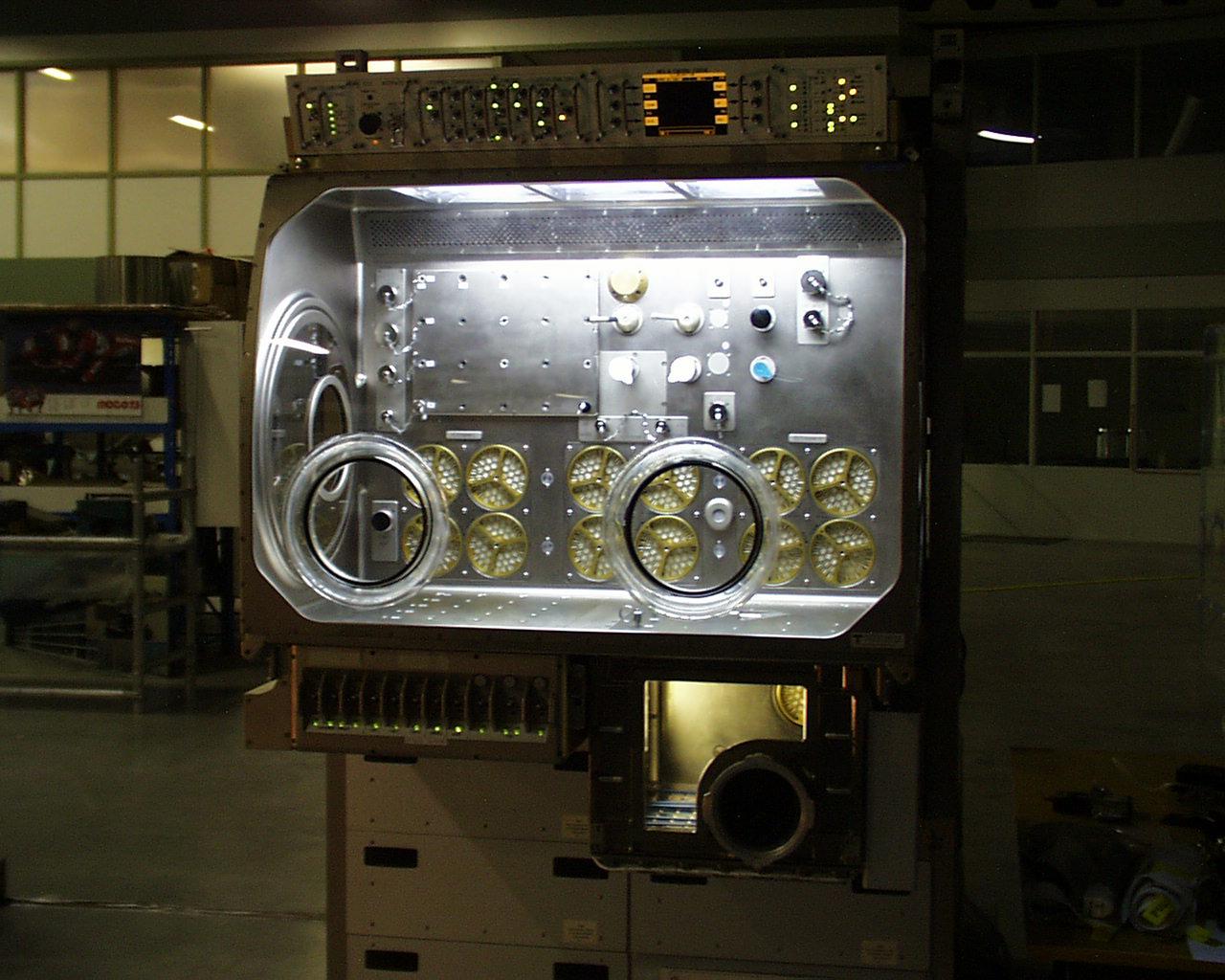 Interior lights give the Microgravity Science Glovebox (MSG) the appearance of a high-tech juke box. The European Space Agency (ESA) and NASA are developing the MSG for use aboard the International Space Station (ISS). Scientists will use the MSG to carry out multidisciplinary studies in combustion science, fluid physics and materials science. The MSG is managed by NASA's Marshall Space Flight Center (MSFC). Photo Credit: NASA/MSFC