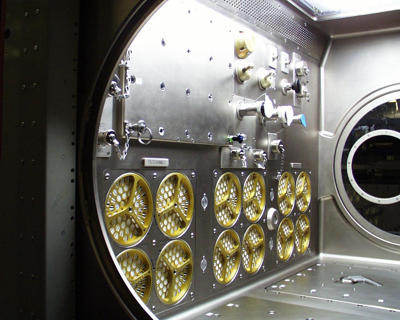 Interior lights give the Microgravity Science Glovebox (MSG) the appearance of a high-tech juke box. The European Space Agency (ESA) and NASA are developing the MSG for use aboard the International Space Station (ISS). Scientists will use the MSG to carry out multidisciplinary studies in combustion science, fluid physics and materials science. The MSG is managed by NASA's Marshall Space Flight Center (MSFC). Photo Credit: NASA/MSFC