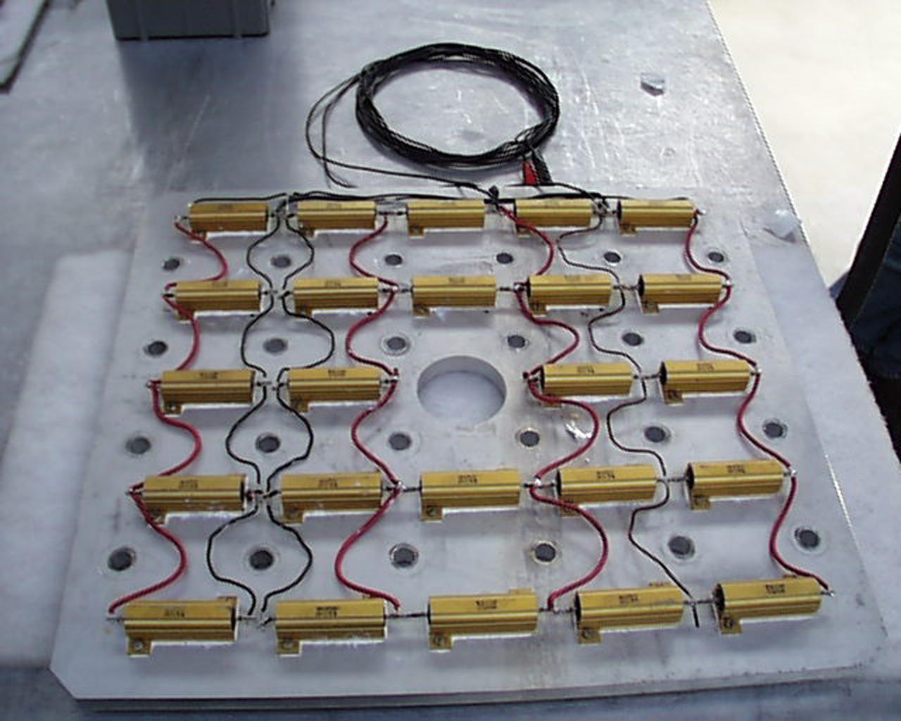 An array of miniature lamps will provide illumination to help scientists as they conduct experiments inside the Microgravity Science Glovebox (MSG). The European Space Agency (ESA) and NASA are developing the MSG for use aboard the International Space Station (ISS). Scientists will use the MSG to carry out multidisciplinary studies in combustion science, fluid physics and materials science. The MSG is managed by NASA's Marshall Space Flight Center (MSFC). Photo Credit: NASA/MSFC