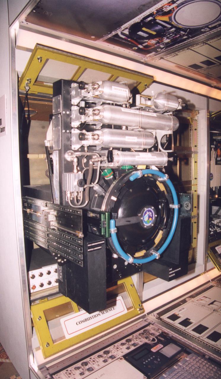 The combustion chamber for the Combustion Integrated Rack section of the Fluids and Combustion Facility (FCF) is shown extracted for servicing. The FCF will be installed, in phases, in the Destiny, the U.S. Laboratory Module of the International Space Station (ISS), and will accommodate multiple users for a range of investigations. This is an engineering mockup; the flight hardware is subject to change as designs are refined. The FCF is being developed by the Microgravity Science Division (MSD) at the NASA Glenn Research Center. (Photo credit: NASA/Marshall Space Flight Center)