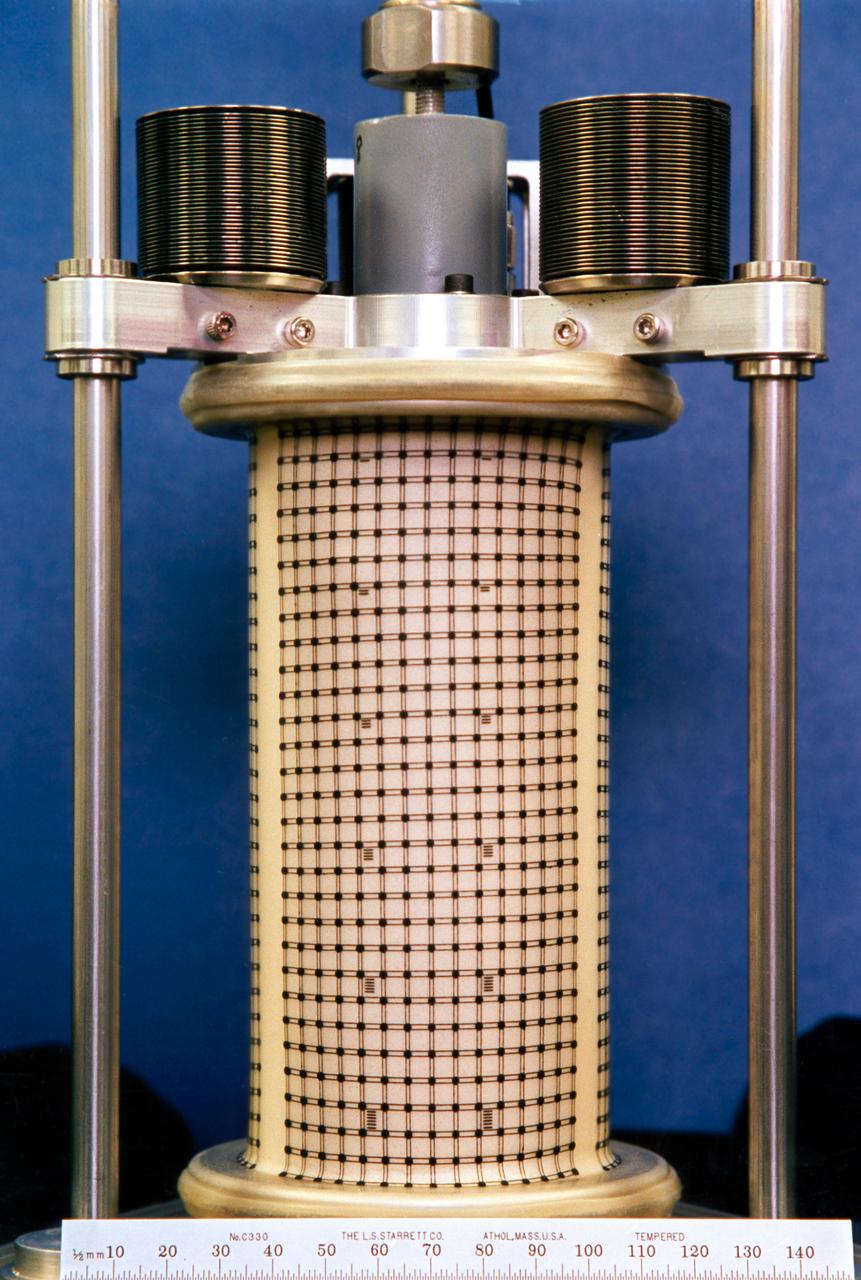One of three Mechanics of Granular Materials (MGM) test cells after flight on STS-79 and before impregnation with resin. Note that the sand column has bulged in the middle, and that the top of the column is several inches lower than the top of the plastic enclosure. Sand and soil grains have faces that can cause friction as they roll and slide against each other, or even cause sticking and form small voids between grains. This complex behavior can cause soil to behave like a liquid under certain conditions such as earthquakes or when powders are handled in industrial processes. Mechanics of Granular Materials (MGM) experiments aboard the Space Shuttle use the microgravity of space to simulate this behavior under conditons that carnot be achieved in laboratory tests on Earth. MGM is shedding light on the behavior of fine-grain materials under low effective stresses. Applications include earthquake engineering, granular flow technologies (such as powder feed systems for pharmaceuticals and fertilizers), and terrestrial and planetary geology. Nine MGM specimens have flown on two Space Shuttle flights. Another three are scheduled to fly on STS-107. The principal investigator is Stein Sture of the University of Colorado at Boulder. Credit: University of Colorado at Boulder