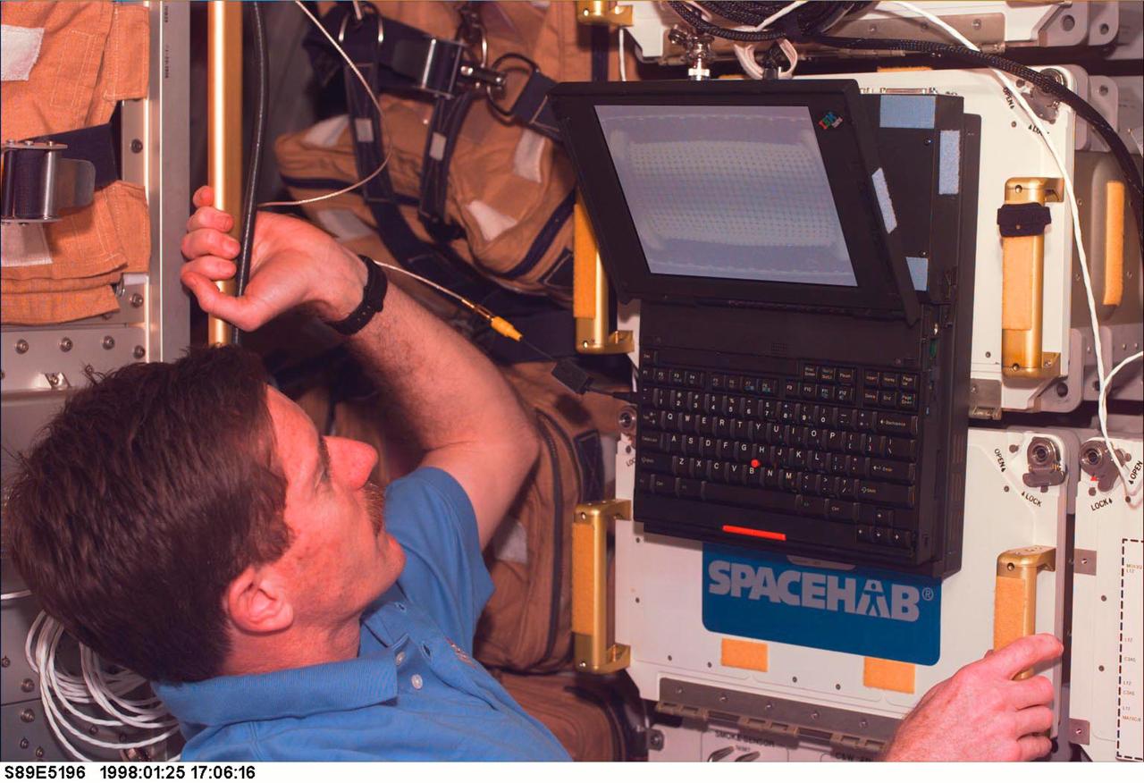 Astronaut James Reilly uses a laptop computer monitor the Mechanics of Granular Materials (MGM) experiment during STS-89. Sand and soil grains have faces that can cause friction as they roll and slide against each other, or even cause sticking and form small voids between grains. This complex behavior can cause soil to behave like a liquid under certain conditions such as earthquakes or when powders are handled in industrial processes. Mechanics of Granular Materials (MGM) experiments aboard the Space Shuttle use the microgravity of space to simulate this behavior under conditons that carnot be achieved in laboratory tests on Earth. MGM is shedding light on the behavior of fine-grain materials under low effective stresses. Applications include earthquake engineering, granular flow technologies (such as powder feed systems for pharmaceuticals and fertilizers), and terrestrial and planetary geology. Nine MGM specimens have flown on two Space Shuttle flights. Another three are scheduled to fly on STS-107. The principal investigator is Stein Sture of the University of Colorado at Boulder. Credit: NASA/Marshall Space Flight Center (MSFC)