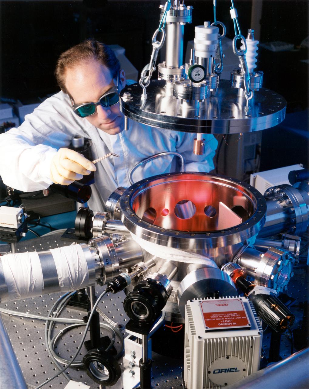 Dr. Rulison of Space System LORAl working with the Electrostatic Levitation (ESL) prior to the donation. Space System/LORAL donated the electrostatic containerless processing system to NASA's Marshall Space Flight Center (MSFC). The official hand over took place in July 1998.
