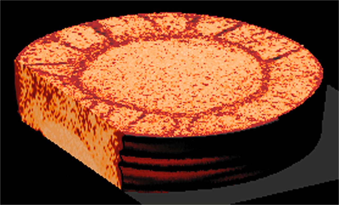 CT scans of the spcimens on STS-79 reveal internal cone-shaped features and radial patterns not seen in specimens processed on the ground. The lighter areas are the densest in these images. CT scans produced richly detailed images allowing scientists to build 3D models of the interior of the specimens that can be compared with microscopic examination of thin slices. This view is made from a series of horizontal slices. Sand and soil grains have faces that can cause friction as they roll and slide against each other, or even cause sticking and form small voids between grains. This complex behavior can cause soil to behave like a liquid under certain conditions such as earthquakes or when powders are handled in industrial processes. Mechanics of Granular Materials (MGM) experiments aboard the Space Shuttle use the microgravity of space to simulate this behavior under conditions that carnot be achieved in laboratory tests on Earth. MGM is shedding light on the behavior of fine-grain materials under low effective stresses. Applications include earthquake engineering, granular flow technologies (such as powder feed systems for pharmaceuticals and fertilizers), and terrestrial and planetary geology. Nine MGM specimens have flown on two Space Shuttle flights. Another three are scheduled to fly on STS-107. The principal investigator is Stein Sture of the University of Colorado at Boulder. Credit: Los Alamos National Laboratory and the University of Colorado at Boulder.