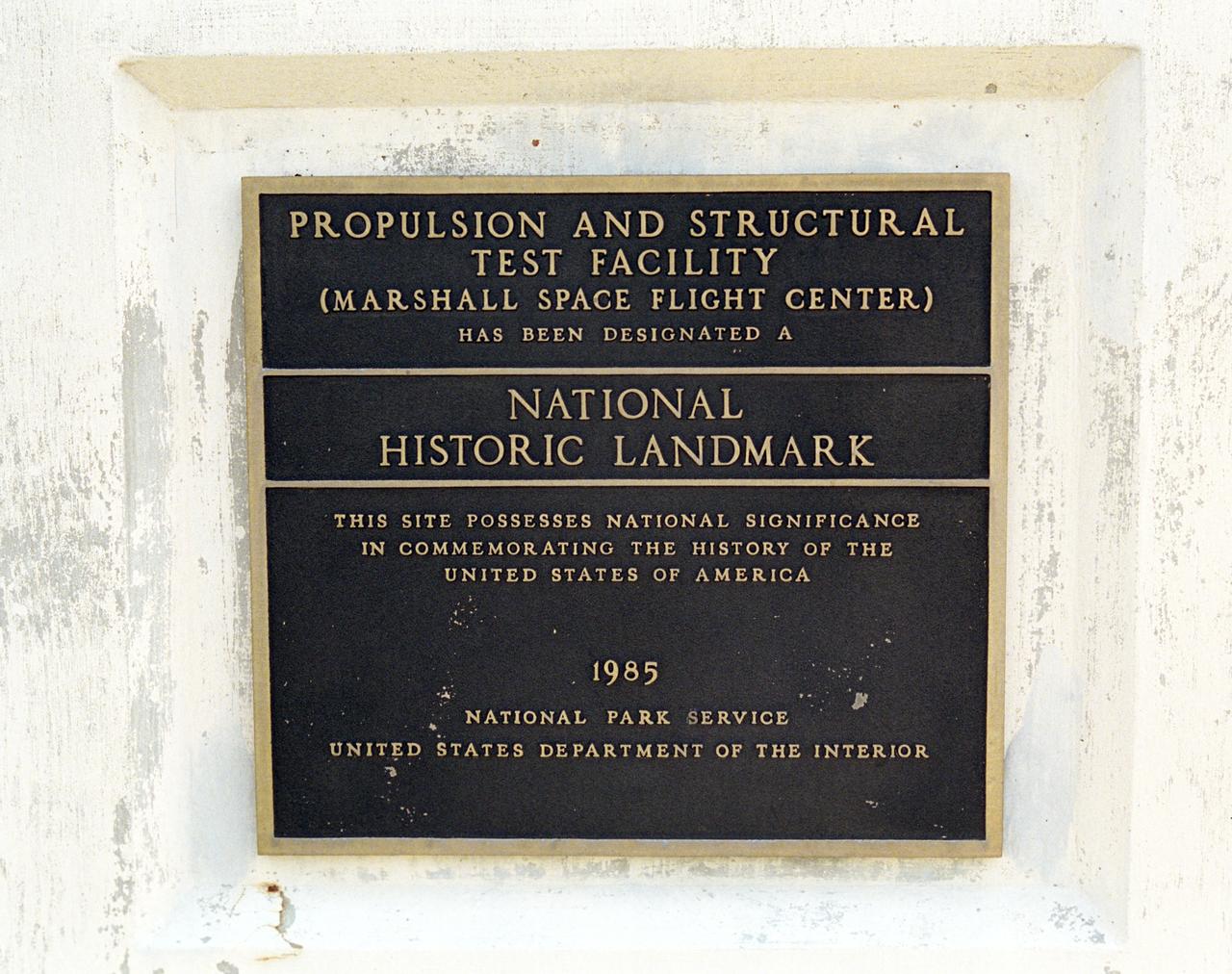 This plaque, displayed on the grounds of Marshall Space Flight Center in Huntsville, Alabama, commemorates the designation of the Propulsion and Structural Test Facility as a National Historic Landmark by the National Park Service of the United States Interior.  The site was designated as a landmark in 1985.