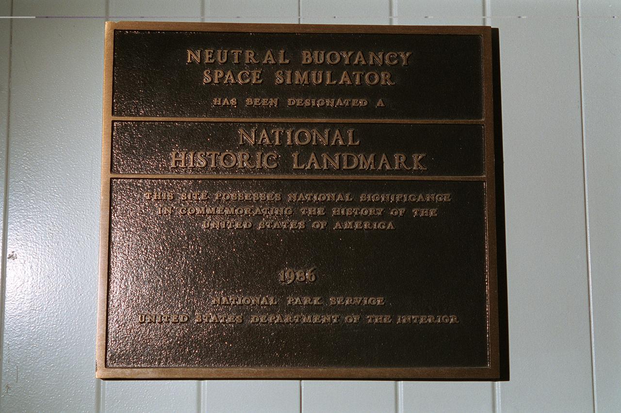 This plaque, displayed on the grounds of Marshall Space Flight Center in Huntsville, Alabama commemorates the Neutral Buoyancy Space Simulator as a National Historic Landmark. The site was designated as such in 1986 by the National Park Service of the United States Department of the Interior.