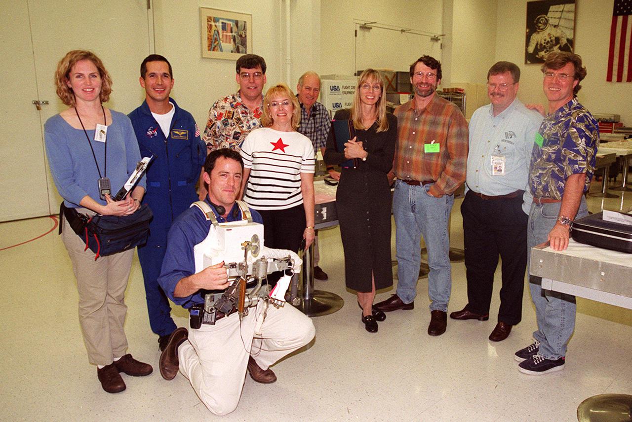 The crew of the television series This Old House pauses for a photo during a tour of KSC. At the far right is Steve Thomas, host of the series. Second from the right is Norm Abram, master carpenter on the show. Accompanying the film crew is astronaut John Herrington (second from left). The cast and crew of This Old House are filming at KSC for an episode of the show
