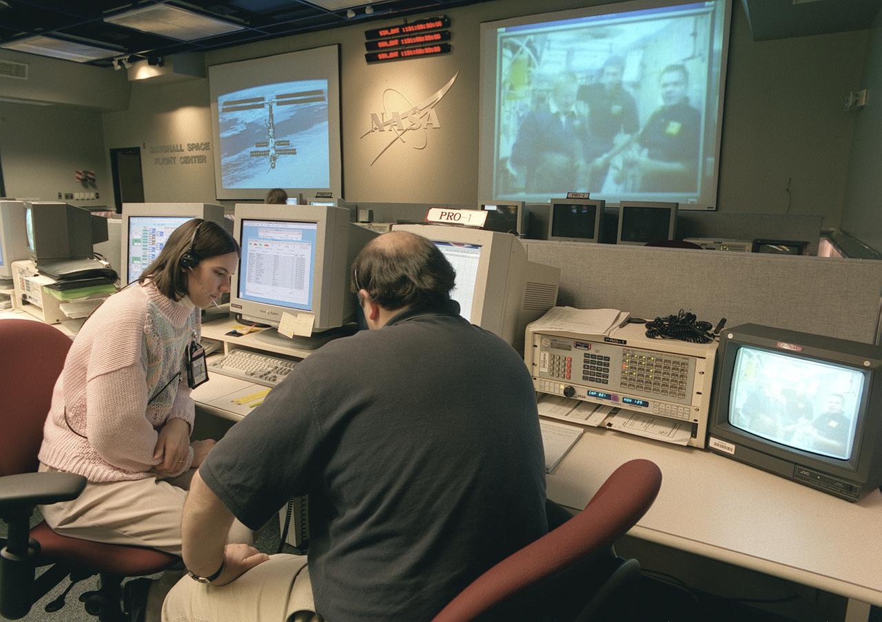 The Payload Operations Center (POC) is the science command post for the International Space Station (ISS). Located at NASA's Marshall Space Flight Center in Huntsville, Alabama, it is the focal point for American and international science activities aboard the ISS. The POC's unique capabilities allow science experts and researchers around the world to perform cutting-edge science in the unique microgravity environment of space. The POC is staffed around the clock by shifts of payload flight controllers. At any given time, 8 to 10 flight controllers are on consoles operating, plarning for, and controlling various systems and payloads. This photograph shows a Payload Rack Officer (PRO) at a work station. The PRO is linked by a computer to all payload racks aboard the ISS. The PRO monitors and configures the resources and environment for science experiments including EXPRESS Racks, multiple-payload racks designed for commercial payloads.