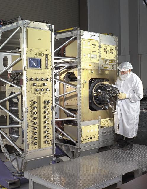 Exterior view of Combustion Module-2 with an Experiment Module partially extracted during a crew training session. The original CM flew on the Microgravity Sciences Lab-1 and 1R in 1997. It has been refurbished and placed in new racks for flight on the STS-107 Research 1 mission in 2001. See MSFC 0100158 for a view with callouts. Glenn Research in Cleveland, OH, manages the project.