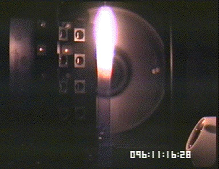 The Laminar Soot Processes (LSP) experiment under way during the Microgravity Sciences Lab-1 mission in 1997. LSP-2 will fly in the STS-107 Research 1 mission in 2001. The principal investigator is Dr. Gerard Faeth of the University of Michigan. LSP uses a small jet burner, similar to a classroom butane lighter, that produces flames up to 60 mm (2.3 in) long. Measurements include color TV cameras and a temperature sensor, and laser images whose darkness indicates the quantity of soot produced in the flame. Glenn Research in Cleveland, OH, manages the project.