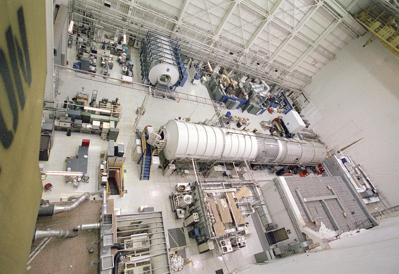 The Marshall Space Flight Center (MSFC) is responsible for designing and building the life support systems that will provide the crew of the International Space Station (ISS) a comfortable environment in which to live and work. Scientists and engineers at the MSFC are working together to provide the ISS with systems that are safe, efficient, and cost-effective. These compact and powerful systems are collectively called the Environmental Control and Life Support Systems, or simply, ECLSS. This is a view of the ECLSS and the Internal Thermal Control System (ITCS) Test Facility in building 4755, MSFC. In the foreground is the 3-module ECLSS simulator comprised of the U.S. Laboratory Module Simulator, Node 1 Simulator, and Node 3/Habitation Module Simulator. On the left is the ITCS Simulator. The main function of the ITCS is to control the temperature of equipment and hardware installed in a typical ISS Payload Rack. 