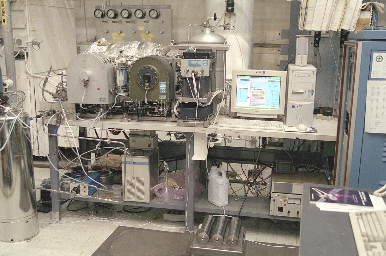 The Marshall Space Flight Center (MSFC) is responsible for designing and building the life support systems that will provide the crew of the International Space Station (ISS) a comfortable environment in which to live and work. Scientists and engineers at the MSFC are working together to provide the ISS with systems that are safe, efficient, and cost-effective. These compact and powerful systems are collectively called the Environmental Control and Life Support Systems, or simply, ECLSS. This photograph shows the fifth generation Urine Processor Development Hardware. The Urine Processor Assembly (UPA) is a part of the Water Recovery System (WRS) on the ISS. It uses a chase change process called vapor compression distillation technology to remove contaminants from urine. The UPA accepts and processes pretreated crewmember urine to allow it to be processed along with other wastewaters in the Water Processor Assembly (WPA). The WPA removes free gas, organic, and nonorganic constituents before the water goes through a series of multifiltration beds for further purification. Product water quality is monitored primarily through conductivity measurements. Unacceptable water is sent back through the WPA for reprocessing. Clean water is sent to a storage tank. 