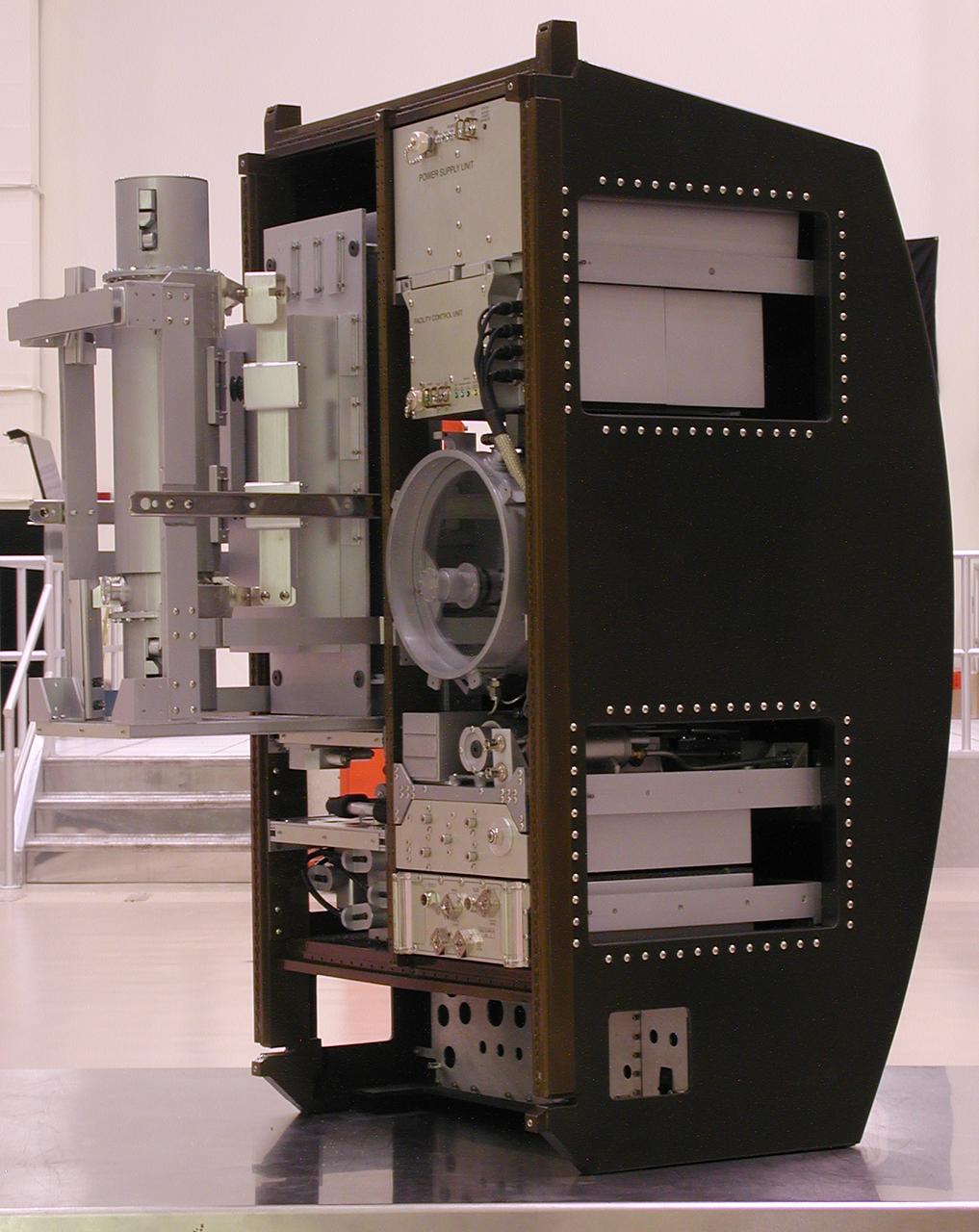 This scale model depicts the Materials Science Research Rack-1 (MSRR-1) being developed by NASA's Marshall Space Flight Center and the European Space Agency (ESA) for placement in the Destiny laboratory module aboard the International Space Station. The rack is part of the plarned Materials Science Research Facility (MSRF) and is expected to include two furnace module inserts, a Quench Module Insert (being developed by NASA's Marshall Space Flight Center) to study directional solidification in rapidly cooled alloys and a Diffusion Module Insert (being developed by the European Space Agency) to study crystal growth, and a transparent furnace (being developed by NASA's Space Product Development program). Multi-user equipment in the rack is being developed under the auspices of NASA's Office of Biological and Physical Research (OBPR) and ESA. Here the transparent furnace is extracted for servicing. Key elements are labeled in other images (0101754, 0101829, 0101830, and TBD).