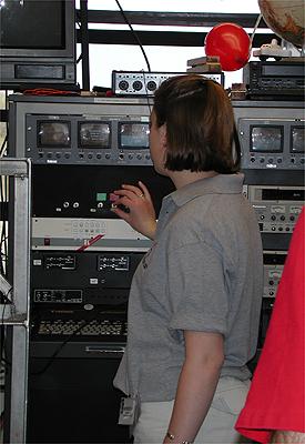 The first NASA Dropping In a Microgravity Environment (DIME) student competition pilot project came to a conclusion at the Glenn Research Center in April 2001. The competition involved high-school student teams who developed the concept for a microgravity experiment and prepared an experiment proposal. The two student teams - COSI Academy, sponsored by the Columbus Center of Science and Industry, and another team from Cincinnati, Ohio's Sycamore High School, designed a microgravity experiment, fabricated the experimental apparatus, and visited NASA Glenn to operate their experiment in the 2.2 Second Drop Tower. Meredith Mendenhall of Sycamore High School, Cincinnati, Ohio, flips on a tape recorder in preparation for a drop. This image is from a digital still camera; higher resolution is not available.