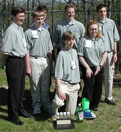The first NASA Dropping In a Microgravity Environment (DIME) student competition pilot project came to a conclusion at the Glenn Research Center in April 2001. The competition involved high-school student teams who developed the concept for a microgravity experiment and prepared an experiment proposal. The two student teams - COSI Academy, sponsored by the Columbus Center of Science and Industry, and another team from Cincinnati, Ohio's Sycamore High School, designed a microgravity experiment, fabricated the experimental apparatus, and visited NASA Glenn to operate their experiment in the 2.2 Second Drop Tower. Pictured are students from COSI Academy, Columbus, Ohio and their teacher. The other team was from Sycamore High School in Cincinnati, Ohio. This image is from a digital still camera; higher resolution is not available.