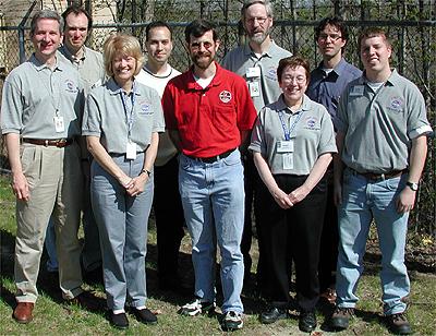 The first NASA Dropping In a Microgravity Environment (DIME) student competition pilot project came to a conclusion at the Glenn Research Center in April 2001. The competition involved high-school student teams who developed the concept for a microgravity experiment and prepared an experiment proposal. The two student teams - COSI Academy, sponsored by the Columbus Center of Science and Industry, and another team from Cincinnati, Ohio's Sycamore High School, designed a microgravity experiment, fabricated the experimental apparatus, and visited NASA Glenn to operate their experiment in the 2.2 Second Drop Tower. NASA and contractor personnel who conducted the DIME activity with the students. Shown (L-R) are: Daniel Dietrich (NASA) mentor for Sycamore High School team), Carol Hodanbosi (National Center for Microgravity Research; DIME staff), Jose Carrion (GRC Akima, drop tower technician), Dennis Stocker (NASA; DIME staff), Richard DeLombard (NASA; DIME staff), Sandi Thompson (NSMR sabbatical teacher; DIME staff), Peter Sunderland (NCMR, mentor for COSI Academy student team), Adam Malcolm (NASA co-op student; DIME staff). This image is from a digital still camera; higher resolution is not available.