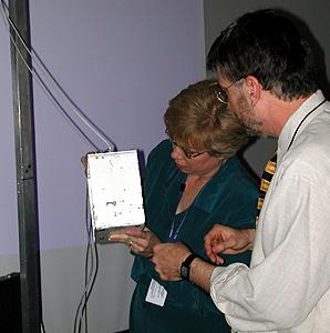 The arnual conference for the Educator Resource Center Network (ERCN) Coordinators was held at Glenn Research Center at Lewis Field in Cleveland, Ohio. The conference included participants from NASA's Educator Resource Centers located throughout the country. The Microgravity Science Division at Glenn sponsored a Microgravity Day for all the conference participants. Dr. Wil Roberson and Marge Lehky prepare a demonstration with the mini-drop tower. This image is from a digital still camera; higher resolution is not available.