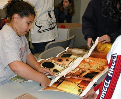Students in the Young Astronaut Program at the Coca-Cola Space Science Center in Columbus, GA, constructed gloveboxes using the new NASA Student Glovebox Education Guide. The young astronauts used cardboard copier paper boxes as the heart of the glovebox. The paper boxes transformed into gloveboxes when the students pasted poster-pictures of an actual NASA microgravity science glovebox inside and outside of the paper boxes. The young astronauts then added holes for gloves and removable transparent top covers, which completed the construction of the gloveboxes. This image is from a digital still camera; higher resolution is not available.