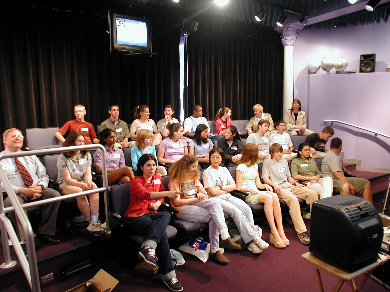 Students from DuPont Manual High School in Louisville, Kentucky participated in a video-teleconference during the Pan-Pacific Basin Workshop on Microgravity Sciences held in Pasadena, California. The event originated at the California Science Center in Los Angeles. The DuPont Manual students patched in to the event through the distance learning lab at the Louisville Science Center. This image is from a digital still camera; higher resolution is not available.