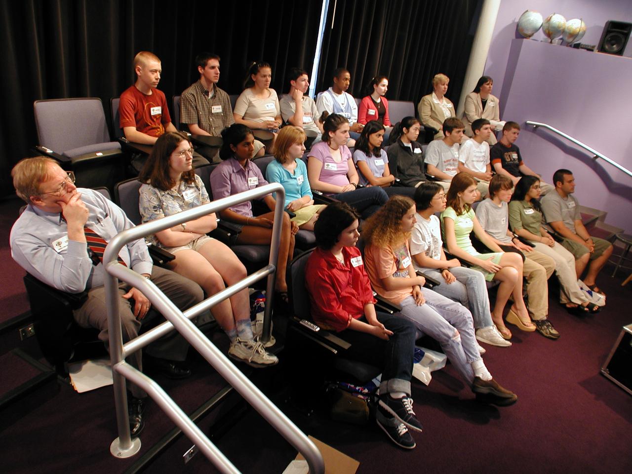 Students from DuPont Manual High School in Louisville, Kentucky participated in a video-teleconference during the Pan-Pacific Basin Workshop on Microgravity Sciences held in Pasadena, California. The event originated at the California Science Center in Los Angeles. The DuPont Manual students patched in to the event through the distance learning lab at the Louisville Science Center. This image is from a digital still camera; higher resolution is not available.
