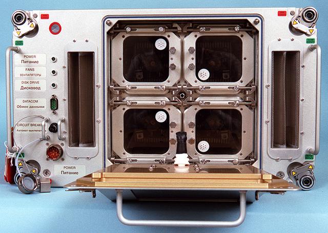 Biotechnology Specimen Temperature Controller (BSTC) will cultivate cells until their turn in the bioreactor; it can also be used in culturing experiments that do not require the bioreactor. The BSTC comprises four incubation/refrigeration chambers individually set at 4 to 50 degreesC (near-freezing to above body temperature). Each chamber holds three rugged tissue chamber modules (12 total), clear Teflon bags holding 30 ml of growth media, all positioned by a metal frame. Every 7 to 21 days (depending on growth rates), an astronaut uses a shrouded syringe and the bags' needleless injection ports to transfer a few cells to a fresh media bag, and to introduce a fixative so that the cells may be studied after flight. The design also lets the crew sample the media to measure glucose, gas, and pH levels, and to inspect cells with a microscope. The controller is monitored by the flight crew through a 23-cm (9-inch) color computer display on the face of the BSTC. This view shows the BTSC with the front panel open. The work is sponsored by NASA's Office of Biological and Physical Research. The bioreactor is managed by the Biotechnology Cell Science Program at NASA's Johnson Space Center (JSC). NASA-sponsored bioreactor research has been instrumental in helping scientists to better understand normal and cancerous tissue development. In cooperation with the medical community, the bioreactor design is being used to prepare better models of human colon, prostate, breast and ovarian tumors. Cartilage, bone marrow, heart muscle, skeletal muscle, pancreatic islet cells, liver and kidney are just a few of the normal tissues being cultured in rotating bioreactors by investigators.