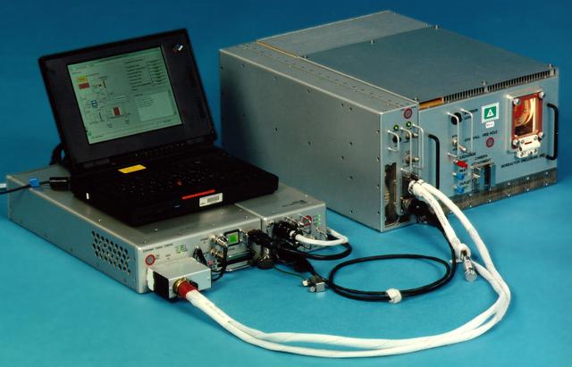 Bioreactor Demonstration System (BDS) comprises an electronics module, a gas supply module, and the incubator module housing the rotating wall vessel and its support systems. Nutrient media are pumped through an oxygenator and the culture vessel. The shell rotates at 0.5 rpm while the irner filter typically rotates at 11.5 rpm to produce a gentle flow that ensures removal of waste products as fresh media are infused. Periodically, some spent media are pumped into a waste bag and replaced by fresh media. When the waste bag is filled, an astronaut drains the waste bag and refills the supply bag through ports on the face of the incubator. Pinch valves and a perfusion pump ensure that no media are exposed to moving parts. An Experiment Control Computer controls the Bioreactor, records conditions, and alerts the crew when problems occur. The crew operates the system through a laptop computer displaying graphics designed for easy crew training and operation. The work is sponsored by NASA's Office of Biological and Physical Research. The bioreactor is managed by the Biotechnology Cell Science Program at NASA's Johnson Space Center (JSC). NASA-sponsored bioreactor research has been instrumental in helping scientists to better understand normal and cancerous tissue development. In cooperation with the medical community, the bioreactor design is being used to prepare better models of human colon, prostate, breast and ovarian tumors. Cartilage, bone marrow, heart muscle, skeletal muscle, pancreatic islet cells, liver and kidney are just a few of the normal tissues being cultured in rotating bioreactors by investigators. See No. 0101824 for a version with labels, and No. 0103180 for an operational schematic.