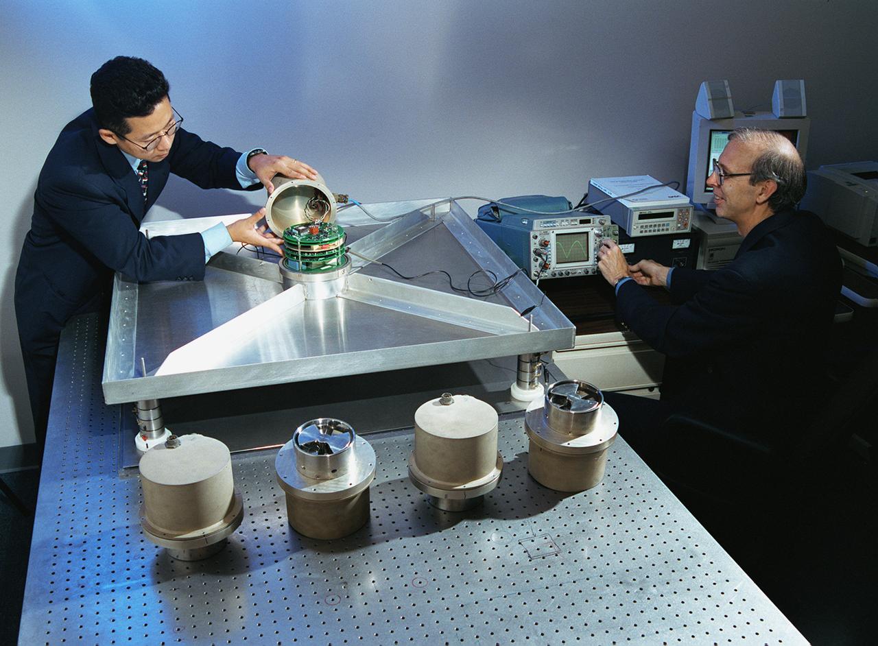 A NASA team studying the causes of electrical storms and their effects on our home planet achieved a milestone on August 21, 2002, completing the study's longest-duration research flight and monitoring four thunderstorms in succession. Radio news media can talk with Dr. Richard Blakeslee, the project's principal investigator, and Tony Kim, project manager at the Marshall Space Flight Center (MSFC), about their results and how their work will help improve future weather forecasting ability. Based at the Naval Air Station Key West, Florida, researchers with the Altus Cumulus Electrification Study (ACES) used the Altus II remotely- piloted aircraft to study a thunderstorm in the Atlantic Ocean off Key West, two storms at the western edge of the Everglades, and a large storm over the northwestern corner of the Everglades. This photograph shows Tony Kim And Dr. Richard Blakeslee of MSFC testing aircraft sensors that would be used to measure the electric fields produced by thunderstorm as part of NASA's ACES. With dual goals of gathering weather data safely and testing the adaptability of the uninhabited aircraft, the ACES study is a collaboration among the MSFC, the University of Alabama in Huntsville, NASA's Goddard Space Flight Center in Greenbelt, Maryland, Pernsylvania State University in University Park, and General Atomics Aeronautical Systems, Inc.