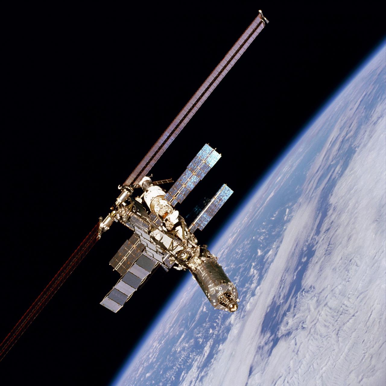 With its new U.S. Laboratory, Destiny, contrasted over a blue and white Earth, the International Space Station (ISS) was photographed by one of the STS-98 crew members aboard the Space Shuttle Atlantis following separation of the Shuttle and Station. The Laboratory is shown at the lower right of the Station. The American-made Destiny module is the cornerstone for space-based research aboard the orbiting platform and the centerpiece of the ISS, where unprecedented science experiments will be performed in the near-zero gravity of space. Destiny will also serve as the command and control center for the ISS. The aluminum module is 8.5- meters (28-feet) long and 4.3-meters (14-feet) in diameter. The laboratory consists of three cylindrical sections and two endcones with hatches that will be mated to other station components. A 50.9-centimeter (20-inch-) diameter window is located on one side of the center module segment. This pressurized module is designed to accommodate pressurized payloads. It has a capacity of 24 rack locations. Payload racks will occupy 15 locations especially designed to support experiments. The Destiny module was built by the Boeing Company under the direction of the Marshall Space Flight Center. 