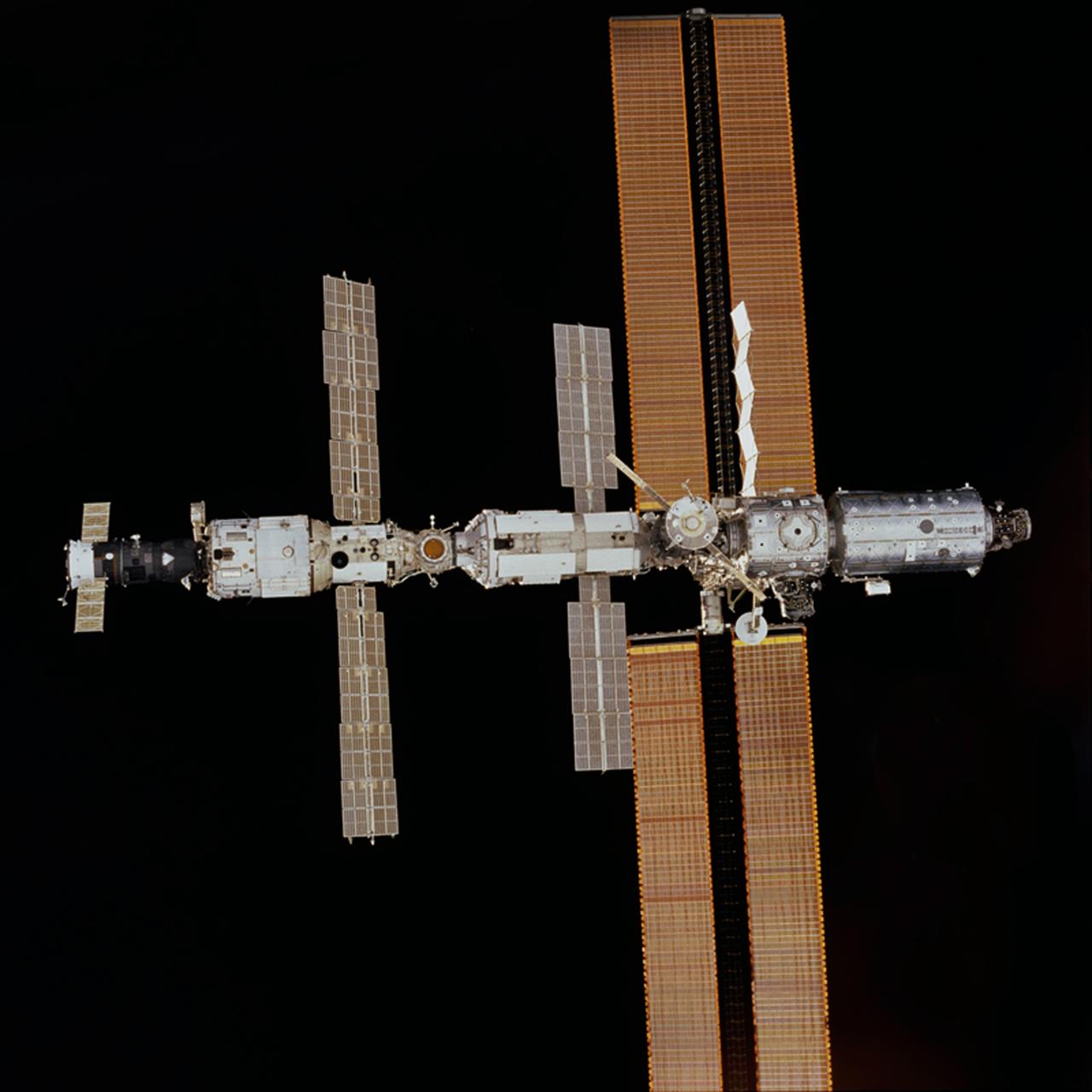 One of the astronauts aboard the Space Shuttle Discovery took this photograph, from the aft flight deck of the Discovery, of the International Space Station (ISS) in orbit. The photo was taken after separation of the orbiter Discovery from the ISS after several days of joint activities and an important crew exchange.