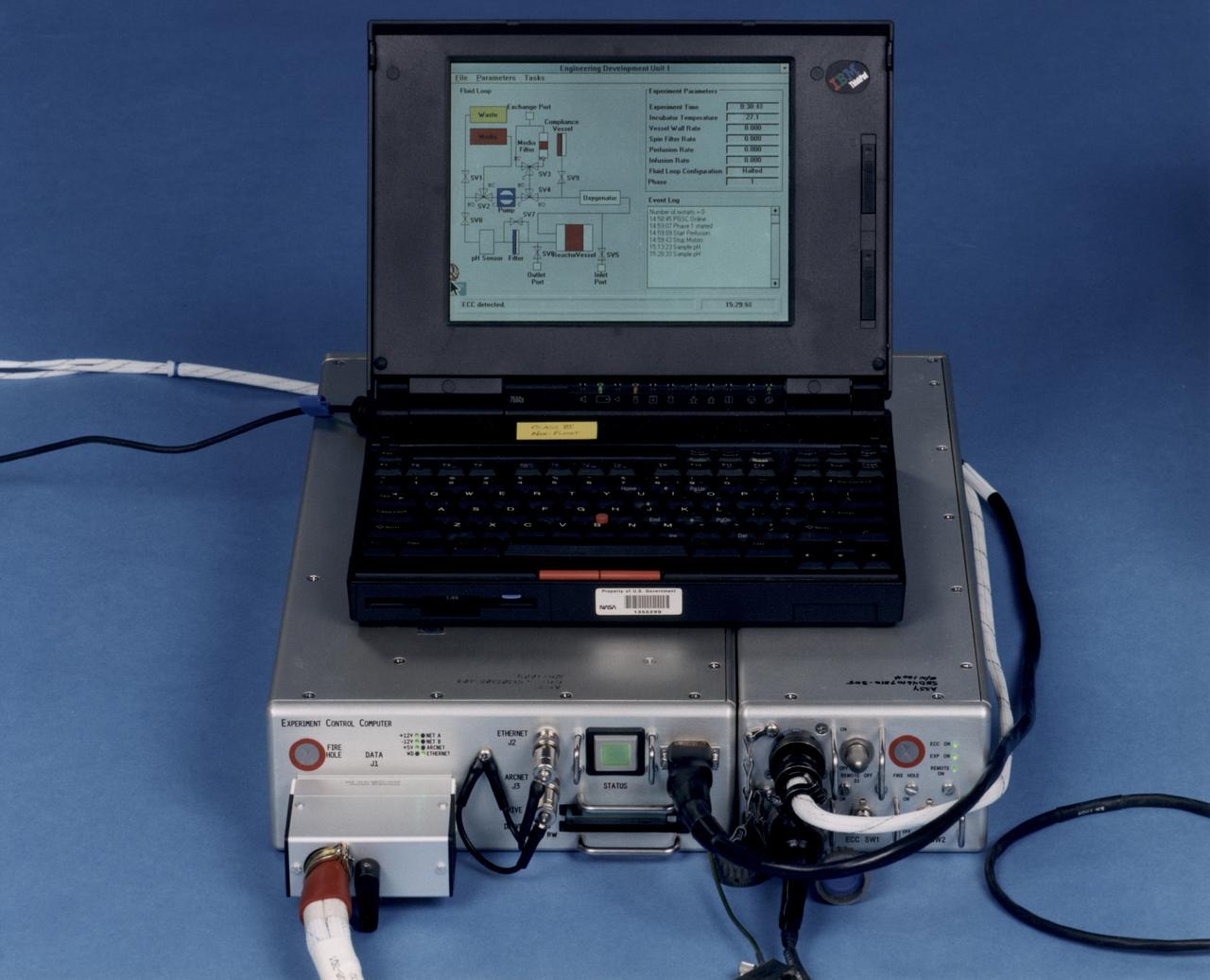 Laptop computer sits atop the Experiment Control Computer for a NASA Bioreactor. The flight crew can change operating conditions in the Bioreactor by using the graphical interface on the laptop. The NASA Bioreactor provides a low turbulence culture environment which promotes the formation of large, three-dimensional cell clusters. The Bioreactor is rotated to provide gentle mixing of fresh and spent nutrient without inducing shear forces that would damage the cells. Due to their high level of cellular organization and specialization, samples constructed in the bioreactor more closely resemble the original tumor or tissue found in the body. The work is sponsored by NASA's Office of Biological and Physical Research. The bioreactor is managed by the Biotechnology Cell Science Program at NASA's Johnson Space Center (JSC). NASA-sponsored bioreactor research has been instrumental in helping scientists to better understand normal and cancerous tissue development. In cooperation with the medical community, the bioreactor design is being used to prepare better models of human colon, prostate, breast and ovarian tumors. Cartilage, bone marrow, heart muscle, skeletal muscle, pancreatic islet cells, liver and kidney are just a few of the normal tissues being cultured in rotating bioreactors by investigators.