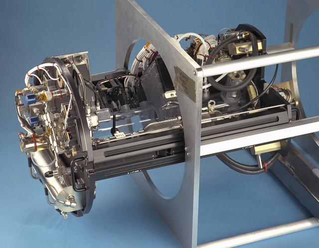 The Water Mist commercial research program is scheduled to fly an investigation on STS-107 in 2002. This investigation will be flown as an Experimental Mounting Structure (EMS) insert into the updated Combustion Module (CM-2), a sophisticated combustion chamber plus diagnostic equipment. (The investigation hardware is shown here mounted in a non-flight frame similar to the EMS.) Water Mist is a commercial research program by the Center for Commercial Applications of Combustion in Space (CCACS), a NASA Commercial Space Center located at the Colorado School of Mines, in Golden, CO and Industry Partner Environmental Engineering Concepts. The program is focused on developing water mist as a replacement for bromine-based chemical fire suppression agents (halons). By conducting the experiments in microgravity, interference from convection currents is minimized and fundamental knowledge can be gained. This knowledge is incorporated into models, which can be used to simulate a variety of physical environments. The immediate objective of the project is to study the effect of a fine water mist on a laminar propagating flame generated in a propane-air mixture at various equivalence ratios. The effects of droplet size and concentration on the speed of the flame front is used as a measure of the effectiveness of fire suppression in this highly controlled experimental environment.