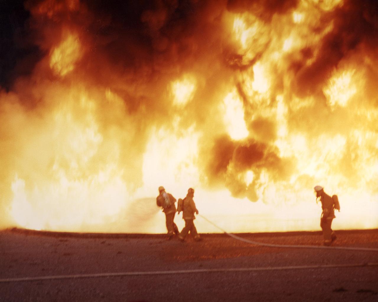Firefighters are like astronauts. They both face dangerous, even hostile environments such as a building full of fire and the vacuum of space. They are both get breathing air from tanks on their backs. Early in the 1970's, NASA began working to improve firefighter breathing systems, which had hardly changed since the 1940s. NASA's Johnson Space Center conducted a 4-year program that applied technology from the portable life support systems used by Apollo astronauts on the moon. The new breathing system is made up of an air bottle, a frame and harness, a face mask, and a warning device. The new system weighs less than 20 pounds, one-third less than the old gear. The new air bottle provides 30 minutes of breathing air, as much as the old system. Like a good hiker's backpack, the new system puts the weight on the firefighter's hips rather than the shoulders. The face mask provides better visibility and the warning device lets the firefighter know when air in the bottle is low. Though they have made many design modifications and refinements, manufacturers of breathing apparatus still incorporate the original NASA technology.