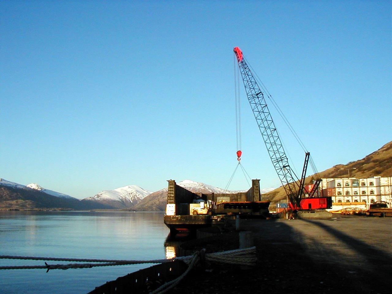 KODIAK ISLAND, Alaska -- A special platform connects the barge with a ramp to allow Castor 120, the first stage of the Athena 1 launch vehicle, to safely move onto the dock at Kodiak Island, Alaska, as preparations to launch Kodiak Star proceed.  The first orbital launch to take place from Alaska's Kodiak Launch Complex, Kodiak Star is scheduled to lift off on a Lockheed Martin Athena I launch vehicle on Sept. 17 during a two-hour window that extends from 5:00 to 7:00 p.m. ADT.  The payloads aboard include the Starshine 3, sponsored by NASA, and the PICOSat, PCSat and Sapphire, sponsored by the Department of Defense (DoD) Space Test Program.       