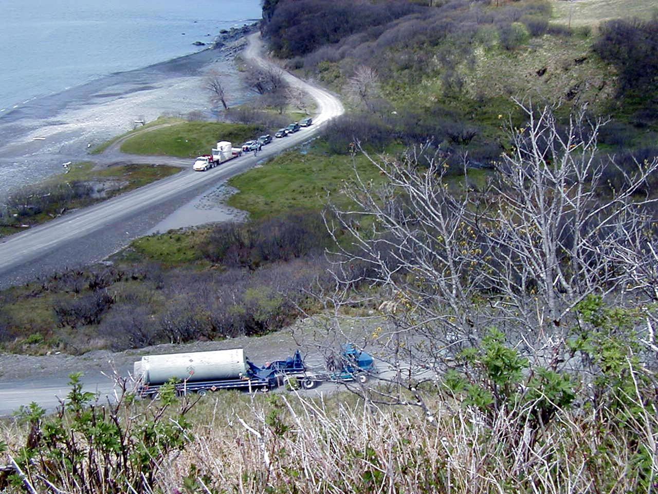 KODIAK ISLAND, Alaska -- The Orbis 21D Equipment Section Boost Motor, the second stage of the Athena 1 launch vehicle, waits for the first stage, Castor 120, to be towed up the steepest part of the road, as preparations to launch Kodiak Star proceed.  The first orbital launch to take place from Alaska's Kodiak Launch Complex, Kodiak Star is scheduled to lift off on a Lockheed Martin Athena I launch vehicle on Sept. 17 during a two-hour window that extends from 5:00 to 7:00 p.m. ADT.  The payloads aboard include the Starshine 3, sponsored by NASA, and the PICOSat, PCSat and Sapphire, sponsored by the Department of Defense (DoD) Space Test Program.     