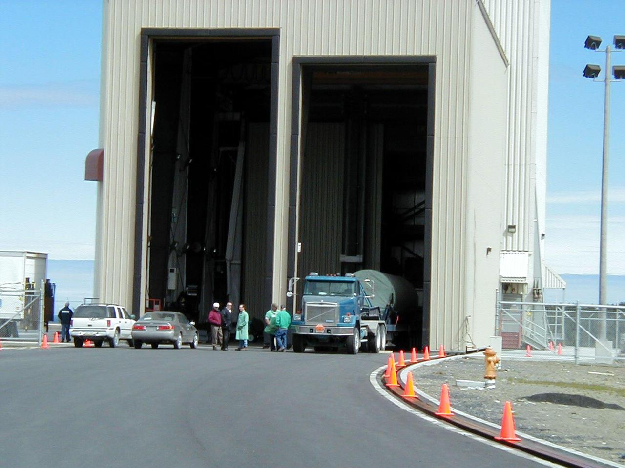 KODIAK ISLAND, Alaska -- Trucks transporting Castor 120, the first stage of the Athena 1 launch vehicle, arrive at Kodiak Island, Alaska, as preparations to launch Kodiak Star proceed.  The first orbital launch to take place from Alaska's Kodiak Launch Complex, Kodiak Star is scheduled to lift off on a Lockheed Martin Athena I launch vehicle on Sept. 17 during a two-hour window that extends from 5:00 to 7:00 p.m. ADT.  The payloads aboard include the Starshine 3, sponsored by NASA, and the PICOSat, PCSat and Sapphire, sponsored by the Department of Defense (DoD) Space Test Program.    