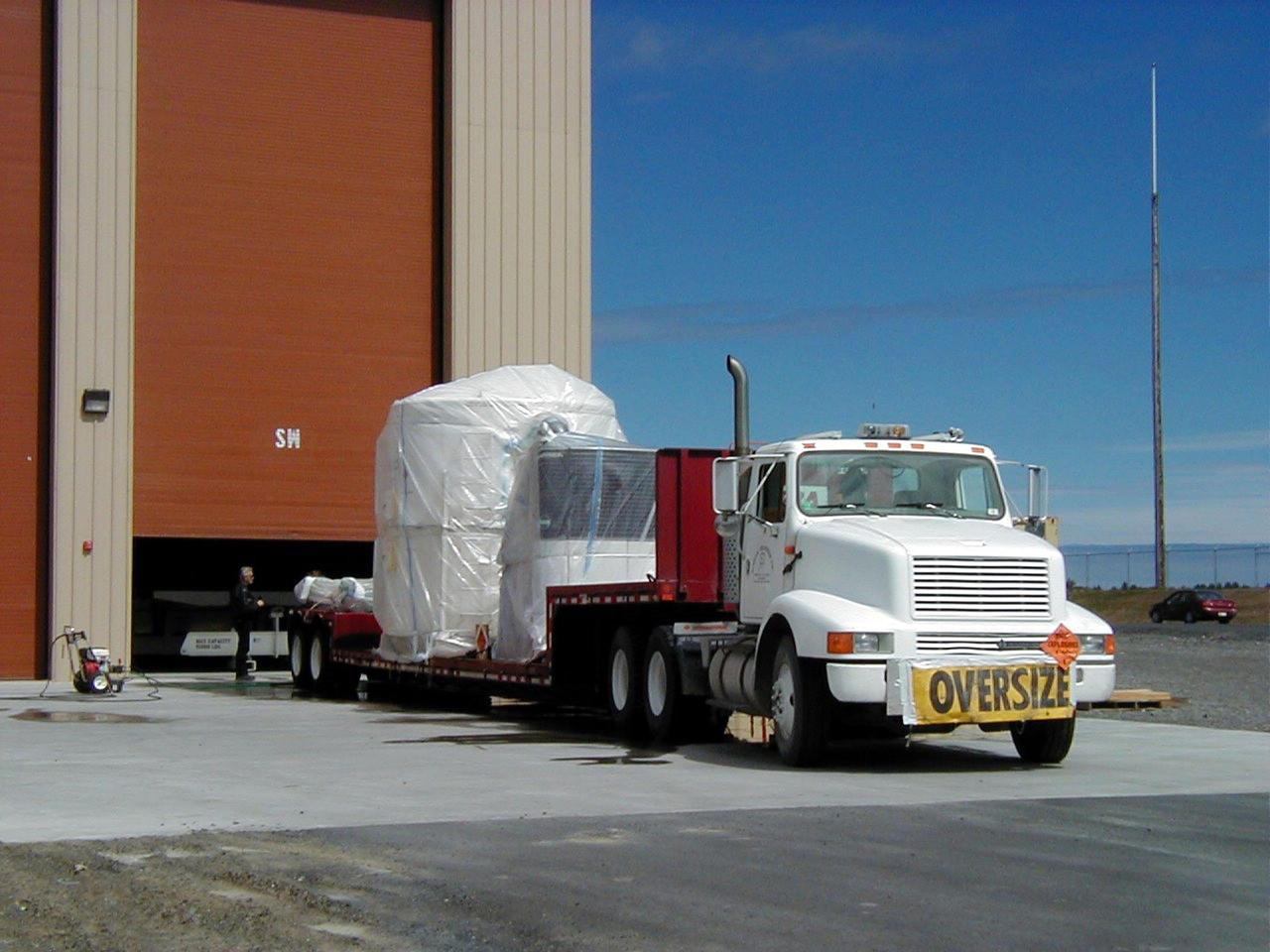 KODIAK ISLAND, Alaska -- Trucks transporting Orbis 21D Equipment Section Boost Motor, the second stage of the Athena 1 launch vehicle, arrive at Kodiak Island, Alaska, as preparations to launch Kodiak Star proceed.  The first orbital launch to take place from Alaska's Kodiak Launch Complex, Kodiak Star is scheduled to lift off on a Lockheed Martin Athena I launch vehicle on Sept. 17 during a two-hour window that extends from 5:00 to 7:00 p.m. ADT.  The payloads aboard include the Starshine 3, sponsored by NASA, and the PICOSat, PCSat and Sapphire, sponsored by the Department of Defense (DoD) Space Test Program.  