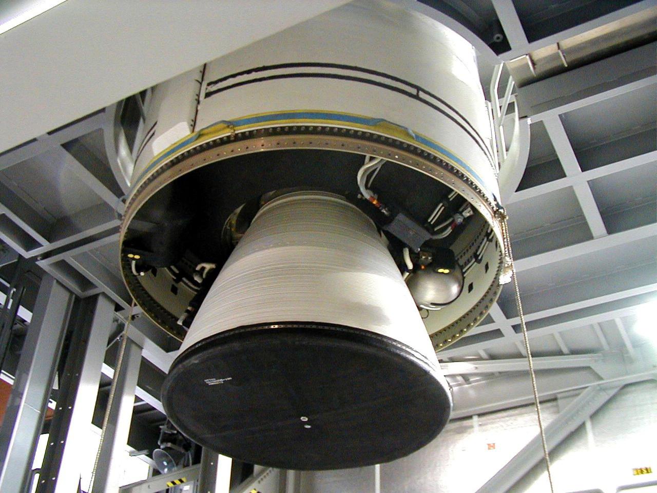 KODIAK ISLAND, Alaska -- Castor 120, the first stage of the Athena 1 launch vehicle, is lowered into place at Kodiak Island, Alaska, as preparations to launch Kodiak Star proceed.  The first orbital launch to take place from Alaska's Kodiak Launch Complex, Kodiak Star is scheduled to lift off on a Lockheed Martin Athena I launch vehicle on Sept. 17 during a two-hour window that extends from 5:00 to 7:00 p.m. ADT.  The payloads aboard include the Starshine 3, sponsored by NASA, and the PICOSat, PCSat and Sapphire, sponsored by the Department of Defense (DoD) Space Test Program.       