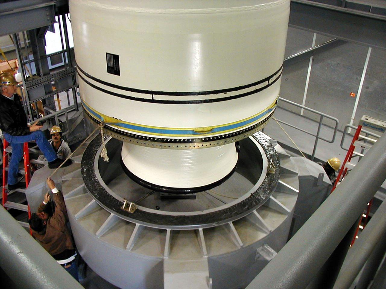 KODIAK ISLAND, Alaska -- Castor 120, the first stage of the Athena 1 launch vehicle, is lowered onto launch mount at Kodiak Island, Alaska, as preparations to launch Kodiak Star proceed.  The first orbital launch to take place from Alaska's Kodiak Launch Complex, Kodiak Star is scheduled to lift off on a Lockheed Martin Athena I launch vehicle on Sept. 17 during a two-hour window that extends from 5:00 to 7:00 p.m. ADT.  The payloads aboard include the Starshine 3, sponsored by NASA, and the PICOSat, PCSat and Sapphire, sponsored by the Department of Defense (DoD) Space Test Program.       