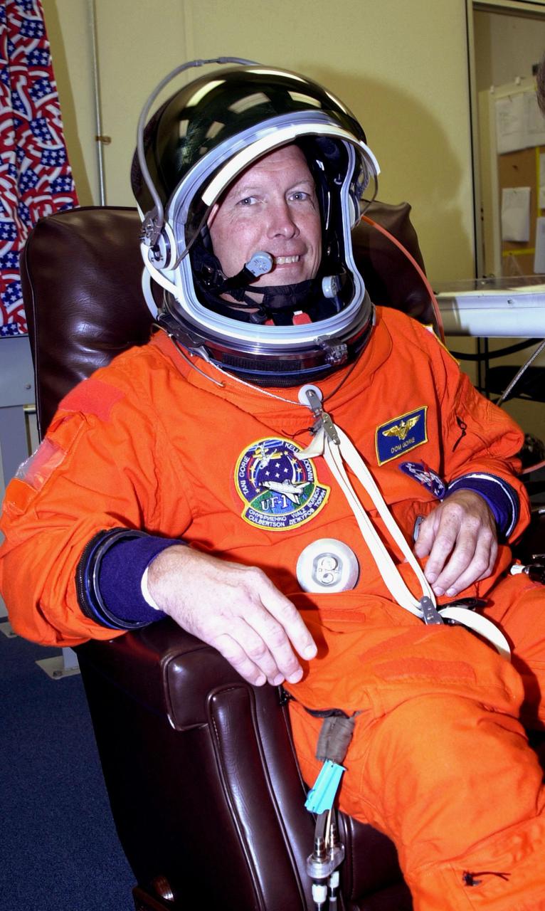 KENNEDY SPACE CENTER, Fla. -- STS-108 Commander Dominic L. Gorie is ready in his launch and entry suit for the second launch attempt of Space Shuttle Endeavour. The first attempt Dec. 4 was scrubbed due to poor weather conditions at KSC. The main goals of the mission are to carry the Expedition 4 crew to the International Space Station as replacement for Expedition 3; carry the Multi-Purpose Logistics Module Raffaello filled with water, equipment and supplies; and install thermal blankets over equipment at the base of the ISS solar wings. STS-108 is the final Shuttle mission of 2001 and the 107th Shuttle flight overall. It is the 12th flight to the Space Station. Launch is scheduled for 5:19 p.m. EST (22:19 GMT) Dec. 5, 2001, from Launch Pad 39B