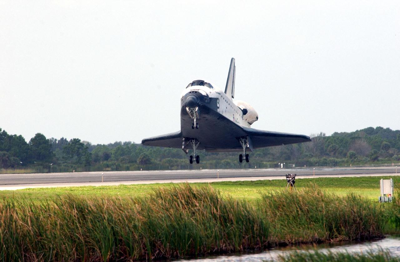 KENNEDY SPACE CENTER, FLA. -- Orbiter Endeavour approaches touchdown on Runway 15 at the KSC Shuttle Landing Facility, completing mission STS-108.  After a mission-elapsed time of 11 days, 19 hours and 35 minutes, the landing is the 57th at KSC in the history of the program. Main gear touchdown occurred at 12:55:10 p.m. EST (17:55:10 GMT), nose gear touchdown at 12:55:23 p.m. (17:55:23 GMT) , wheel stop at 12:56:13 p.m. (17:56:13 GMT).   STS-108 was the 12th mission to the International Space Station.  This mission was the 107th flight in the Shuttle program and the 17th flight for the orbiter. Endeavour carries both the mission crew and the Expedition 3 crew - Commander Frank Culbertson and cosmonauts Vladimir Dezhurov and Mikhail Tyurin - who are returning to Earth after 129 days in space on the Space Station
