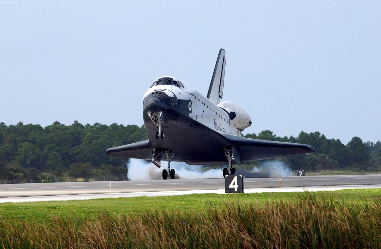KENNEDY SPACE CENTER, FLA. - Orbiter Endeavour kicks up dust as it touches down on Runway 15 at the KSC Shuttle Landing Facility, completing mission STS-108.  After a mission-elapsed time of 11 days, 19 hours and 35 minutes, the landing is the 57th at KSC in the history of the program. Main gear touchdown occurred at 12:55:10 p.m. EST (17:55:10 GMT), nose gear touchdown at 12:55:23 p.m. (17:55:23 GMT) , wheel stop at 12:56:13 p.m. (17:56:13 GMT).   STS-108 was the 12th mission to the International Space Station.  This mission was the 107th flight in the Shuttle program and the 17th flight for the orbiter. Endeavour carries both the mission crew and the Expedition 3 crew - Commander Frank Culbertson and cosmonauts Vladimir Dezhurov and Mikhail Tyurin - who are returning to Earth after 129 days in space on the Space Station