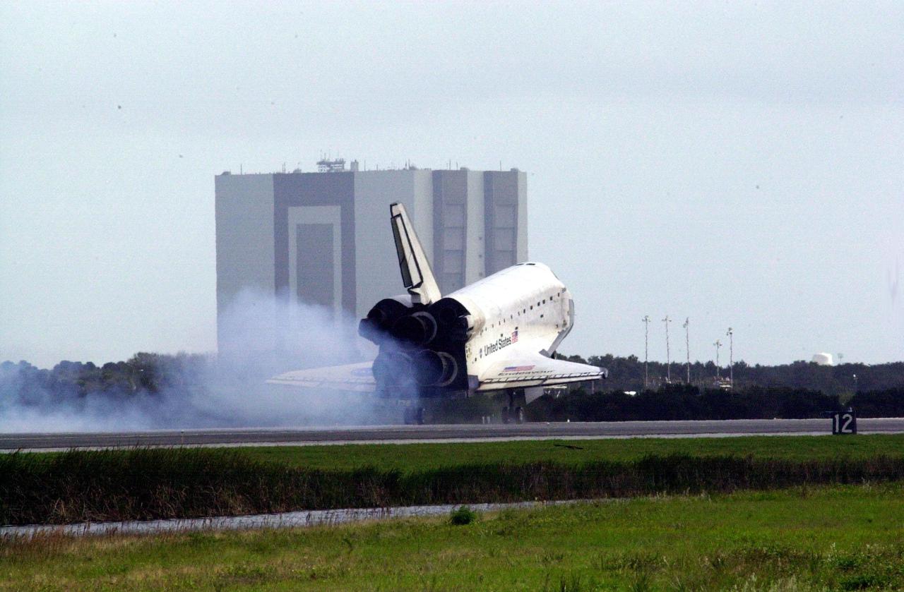 KENNEDY SPACE CENTER, FLA. - Dust streams behind orbiter Endeavour as it touches down on Runway 15 at the Shuttle Landing Facility, completing mission STS-108 after a mission-elapsed time of 11 days, 19 hours and 35 minutes.  The landing is the 57th at KSC in the history of the program. Main gear touchdown occurred at 12:55:10 p.m. EST (17:55:10 GMT), nose gear touchdown at 12:55:23 p.m. (17:55:23 GMT) , wheel stop at 12:56:13 p.m. (17:56:13 GMT).   STS-108 was the 12th mission to the International Space Station.  This mission was the 107th flight in the Shuttle program and the 17th flight for the orbiter. Endeavour carries both the mission crew and the Expedition 3 crew - Commander Frank Culbertson and cosmonauts Vladimir Dezhurov and Mikhail Tyurin - who are returning to Earth after 129 days in space on the Space Station