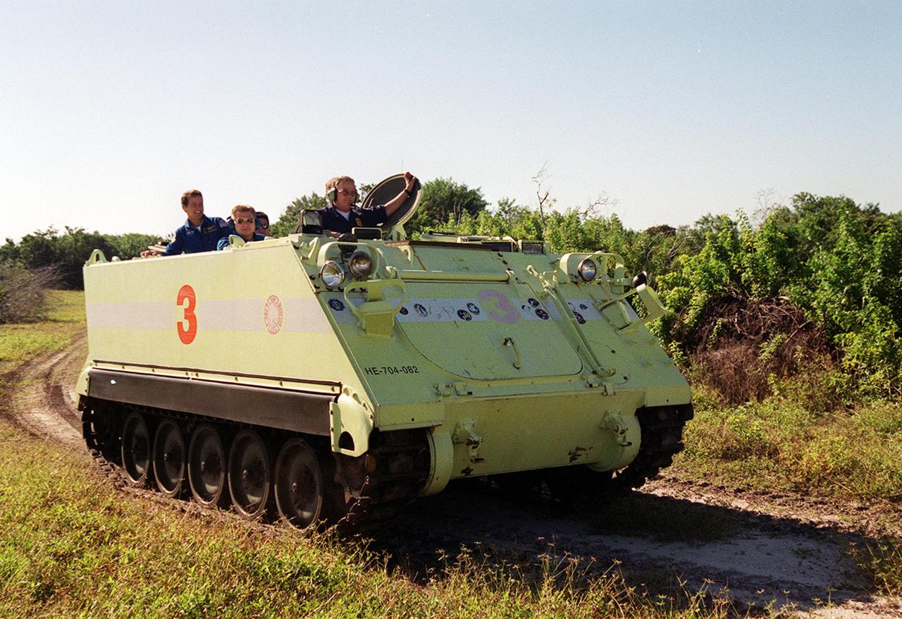 KENNEDY SPACE CENTER, Fla. --  With other crew members as passengers, STS-108 Pilot Mark E. Kelly (not seen) turns the corner driving an M-113 armored personnel carrier. He and other crew members are taking part in Terminal Countdown Demonstration Test activities, which include emergency exit from the launch pad and a simulated launch countdown. STS-108 is a Utilization Flight that will carry the replacement Expedition 4 crew to the International Space Station, as well as the Multi-Purpose Logistics Module Raffaello, filled with supplies and equipment.  The l1-day mission is scheduled for launch Nov. 29 on Space Shuttle Endeavour