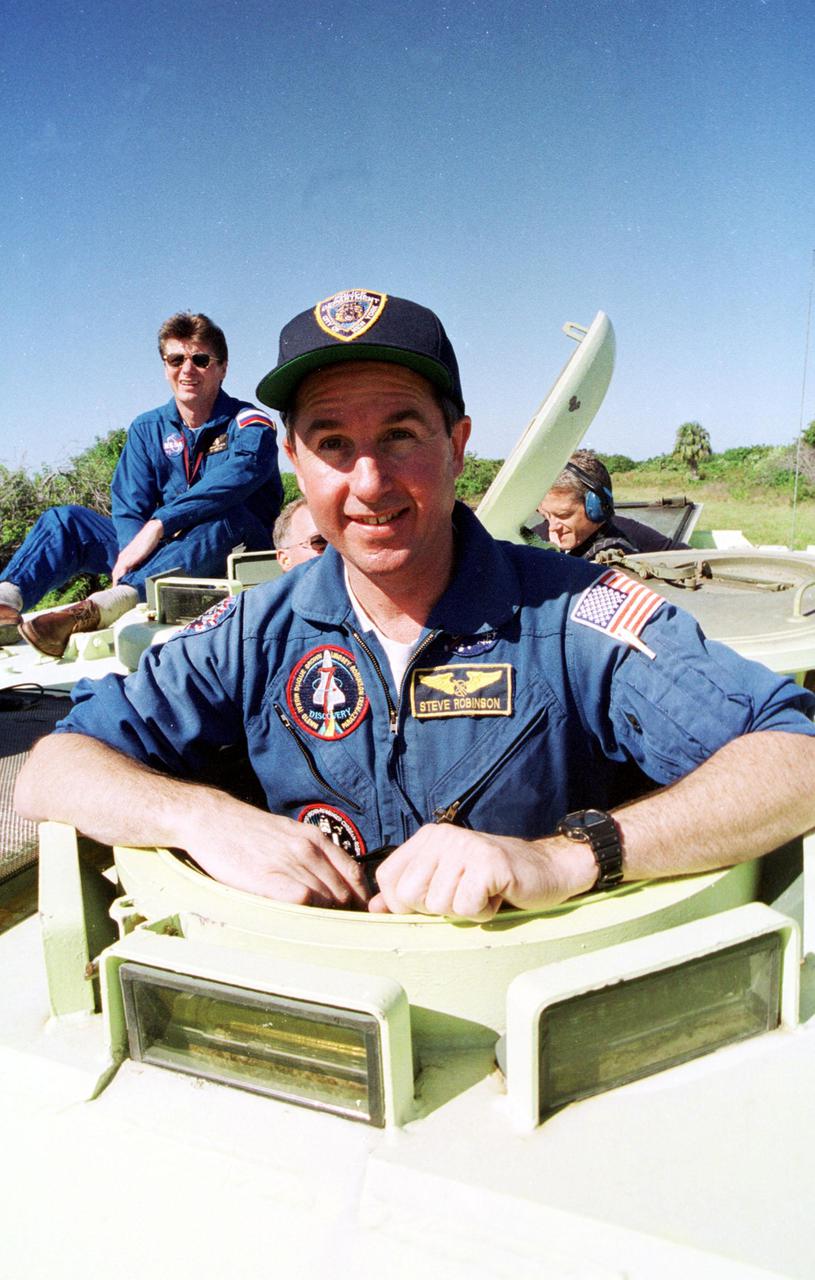 KENNEDY SPACE CENTER, Fla. -- Astronaut Stephen K. Robinson takes his turn at driving an M-113 armored personnel carrier. Robinson is a backup crew member for the International Space Station Expedition 4 crew, who are flying on Space Shuttle Endeavour as part of mission STS-108. Both the mission crew and Expedition 4 crews are at KSC for Terminal Countdown Demonstration Test activities. The TCDT includes emergency exit from the launch pad and a simulated launch countdown. The 11-day mission will also carry the Multi-Purpose Logistics Module Raffaello, filled with supplies and equipment. STS-108 is scheduled to launch Nov. 29