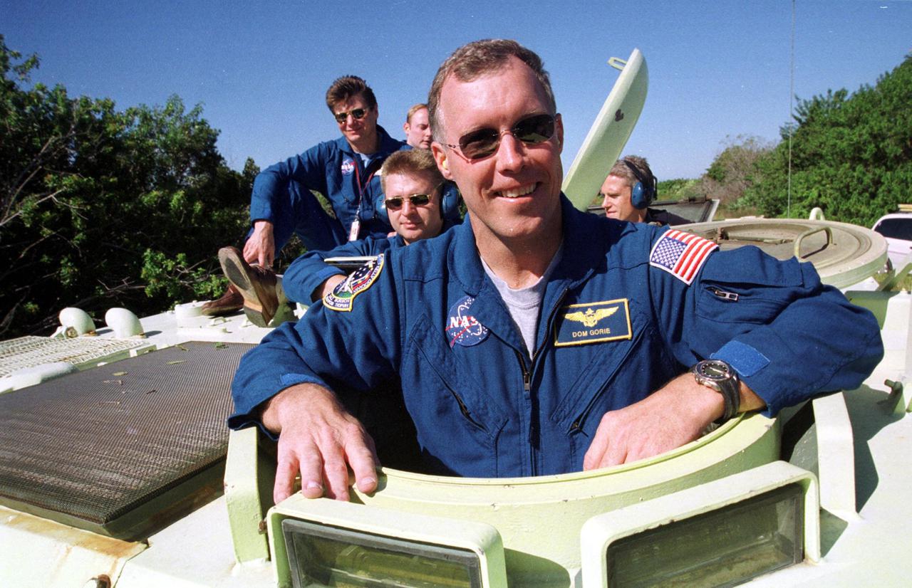 KENNEDY SPACE CENTER, Fla. --  STS-108 Commander Dominic L. Gorie takes his turn at driving an M-113 armored personnel carrier. He and other crew members are taking part in Terminal Countdown Demonstration Test activities, which include emergency exit from the launch pad and a simulated launch countdown. STS-108 is a Utilization Flight that will carry the replacement Expedition 4 crew to the International Space Station, as well as the Multi-Purpose Logistics Module Raffaello, filled with supplies and equipment.  The l1-day mission is scheduled for launch Nov. 29 on Space Shuttle Endeavour