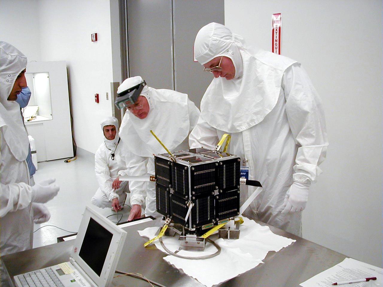 KODIAK ISLAND, Alaska -- Technicians prepare the PICSat payload for its launch aboard the Athena 1 launch vehicle at Kodiak Island, Alaska, as preparations to launch Kodiak Star proceed. The first orbital launch to take place from Alaska's Kodiak Launch Complex, Kodiak Star is scheduled to lift off on a Lockheed Martin Athena I launch vehicle on Sept. 17 during a two-hour window that extends from 5 p.m. to 7 p.m. p.m. ADT. The payloads aboard include the Starshine 3, sponsored by NASA, and the PICOSat, PCSat and Sapphire, sponsored by the Department of Defense (DoD) Space Test Program.     