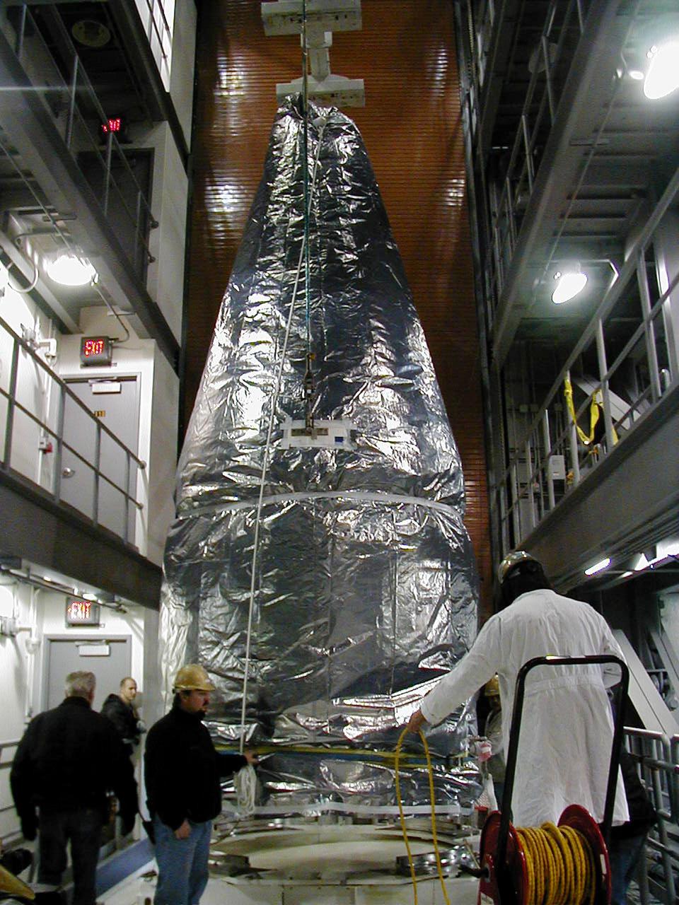 KODIAK ISLAND, ALASKA - Inside the Launch Service Structure, Kodiak Launch Complex (KLC), the final stage of the Athena I launch vehicle, with the Kodiak Star spacecraft, is maneuvered into place. The first launch to take place from KLC, Kodiak Star is scheduled to lift off on a Lockheed Martin Athena I launch vehicle on Sept. 17 during a two-hour window that extends from 5 p.m. to 7 p.m. p.m. ADT. The payloads aboard include the Starshine 3, sponsored by NASA, and the PICOSat, PCSat and Sapphire, sponsored by the Department of Defense (DoD) Space Test Program. KLC is the newest commercial launch complex in the United States, ideal for launch payloads requiring low-Earth polar or sun-synchronous orbits