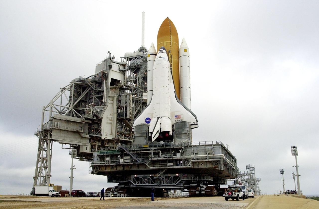 KENNEDY SPACE CENTER, FLA. -- Space Shuttle Atlantis begins moving back to the Vehicle Assembly Building where workers will conduct inspections, make continuity checks and conduct X-ray analysis on the 36 solid rocket booster cables located inside each booster’s system tunnel. An extensive evaluation of NASA’s SRB cable inventory revealed conductor damage in four (of about 200) cables on the shelf. Shuttle managers decided to prove the integrity of the system tunnel cables already on Atlantis before launching Jan. 19. The launch has been rescheduled no earlier than Feb. 6