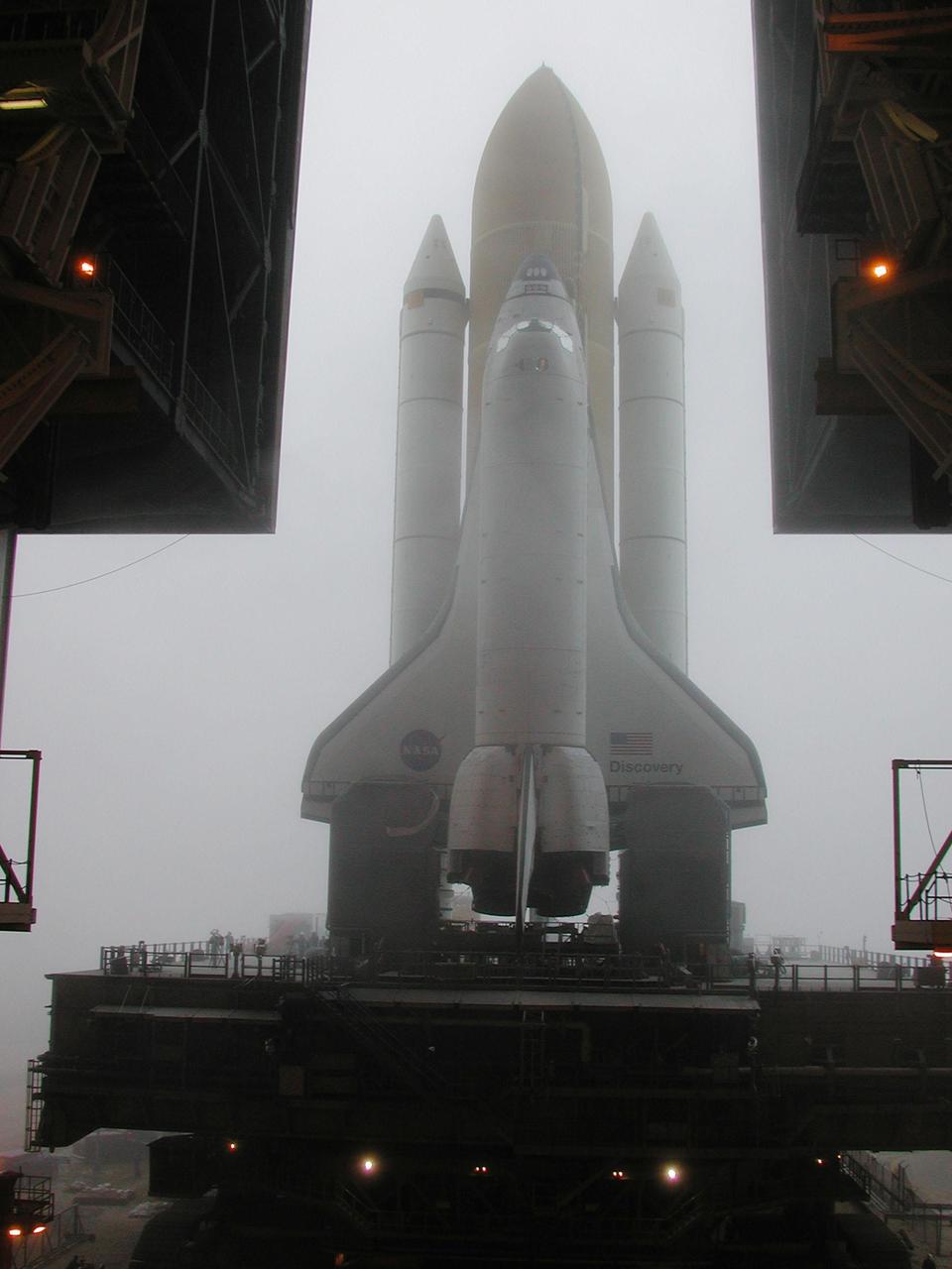 KENNEDY SPACE CENTER, Fla. -- Space Shuttle Discovery begins rolling into the fog that shrouds Kennedy Space Center. Discovery is on its way from the Vehicle Assembly Building to Launch Pad 39B and mission STS-102 to the International Space Station. Its payload is the Multi-Purpose Logistics Module Leonardo, a “moving van,” to carry laboratory racks filled with equipment, experiments and supplies to and from the Space Station aboard the Space Shuttle. The flight will also carry the Expedition Two crew up to the Space Station, replacing Expedition One, who will return to Earth on Discovery.  Launch is scheduled for March 8 at 6:45 a.m. EST
